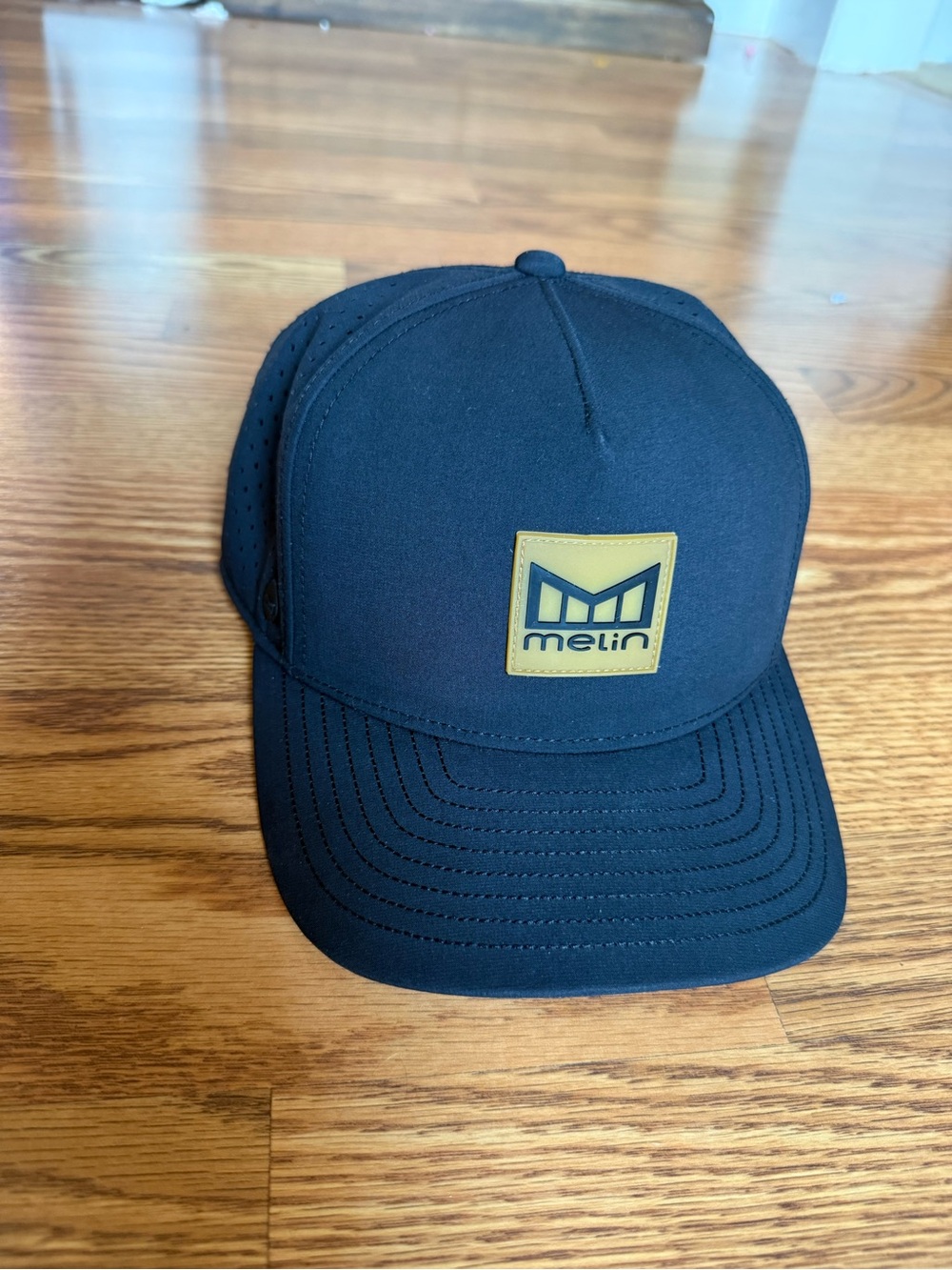 Melin Odyssey Black Logo Patch Trucker Hat Classic